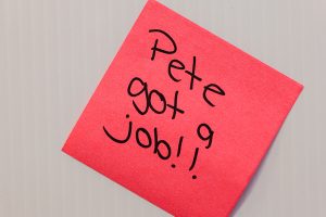Red PostIt note on gray background says "Pete got a job!!"