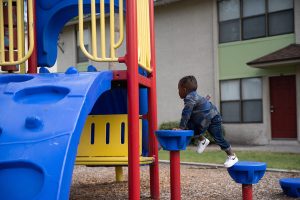 Boy climbs on playground
